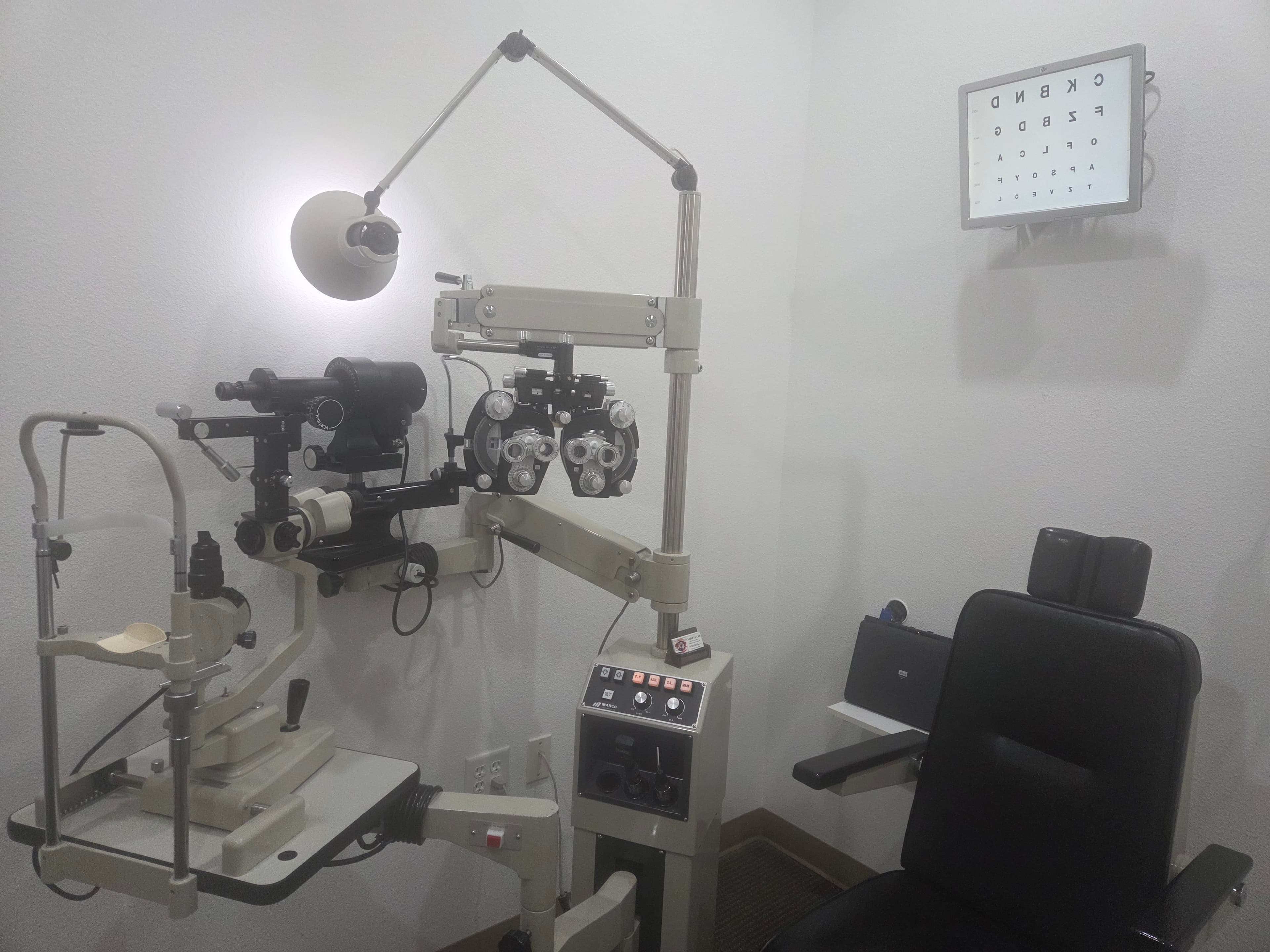 Exam room with phoropter, slit lamp and eye chart
