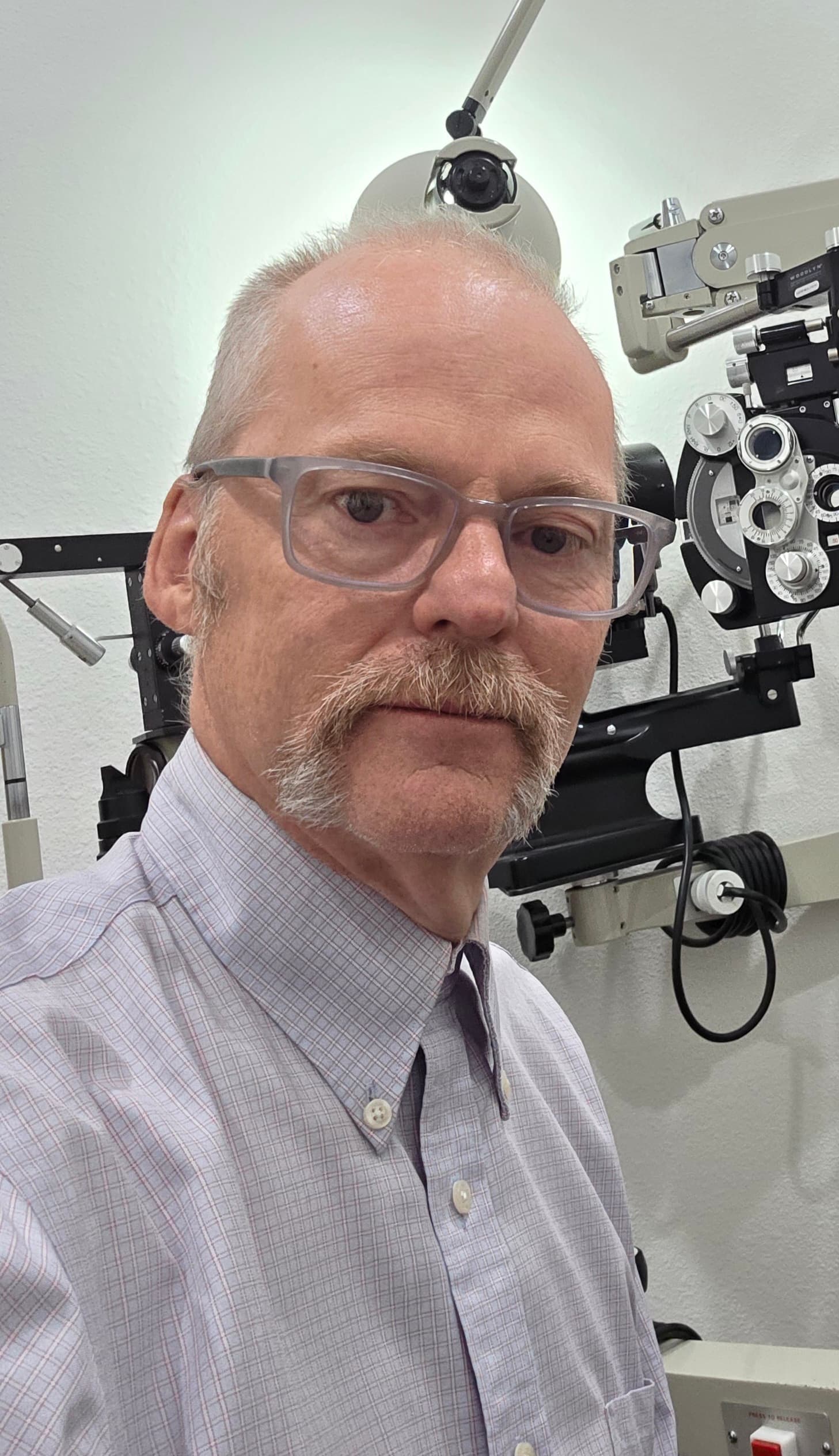Dr. Phillip L. Knapp O.D. in the exam room at Chatfield Eye Care